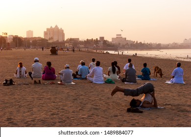  20-03-2006 = 07:41:17In The Morning Hours, Before Sun Rise, A Group Of People From Nearby Locality Doing Their YOGA In The Open Air At Choupati Beach. Mumbai, Maharashtra, India 