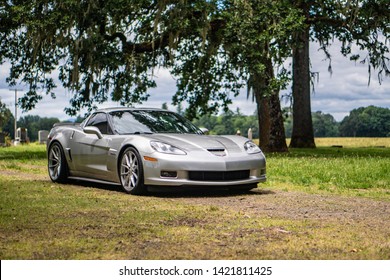 A 2008 Corvette Z06 Sports Car On A Backroad In The Country Side.