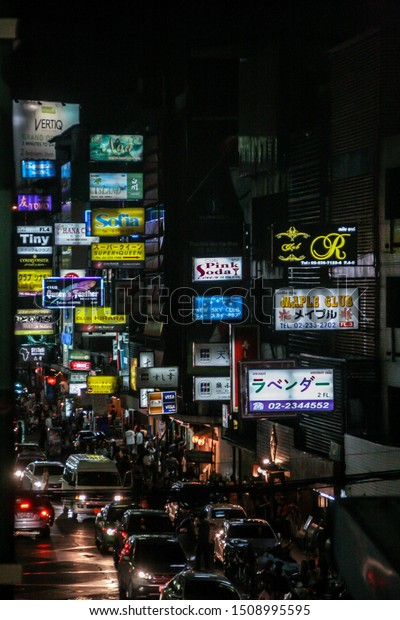 2011.05.13,\
Bangkok, Thailand.  Car traffic at night street of the city, blur\
and grain effect. Bangkok never\
sleeps.