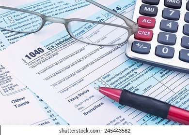 2014 IRS Form 1040 With Calculator And Pen