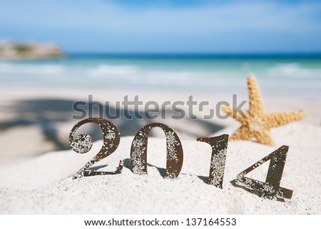 2014 letters with starfish, ocean , beach and seascape, shallow dof