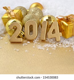 2014 year golden figures on the background of golden CÃ?Â�hristmas balls