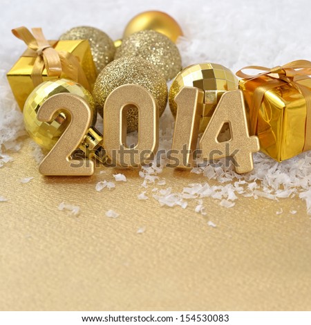 2014 year golden figures on the background of golden CÃ?Â�hristmas balls