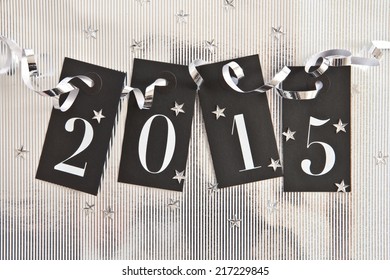 2015 on shiny background with star confetti - Powered by Shutterstock