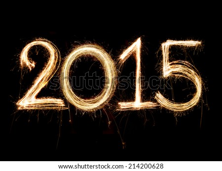 2015 word written with Sparkle firework on black background