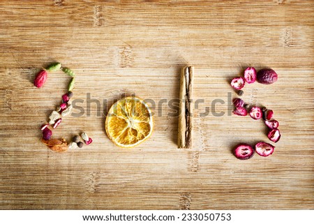 2015 written with spices on wooden background