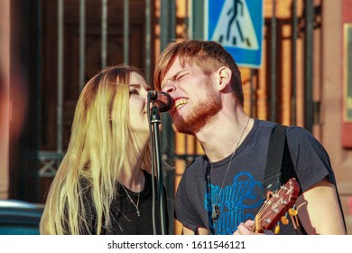 2015.04.12, Moscow, Russia. Street Musicians At Spring Day. Young Singers Singing Song. Cuople In Love Singing Sad Song.