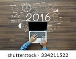 2016 new year business success, Creative thinking drawing charts and graphs strategy plan ideas wooden table background, Inspiration concept with businessman working on laptop computer PC, Top View