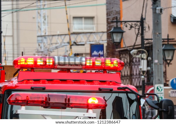 2017\
MARCH 19. TOKYO JAPAN. Red siren light part of firetruck with\
parking and stand by for help at accident place.\
