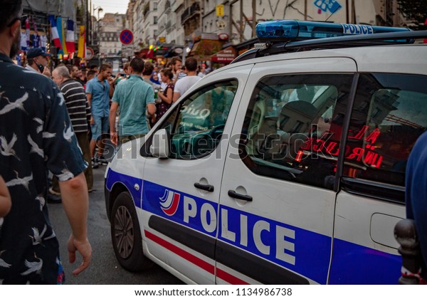 2018,\
July 15th - Paris, France: Street of Paris crowded of happy soccer\
supporters after the final match France\
Croatia.