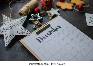 2018 year end review, date planning, appointment, deadline or holiday concept on wooden table next to black clean calendar on month of December.