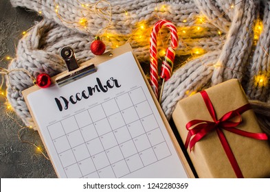 2018 Year End Review, Date Planning, Appointment, Deadline Or Holiday Concept On Wooden Table Next To Black Clean Calendar On Month Of December.