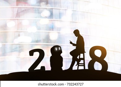 2018 Years Of Robot Assistant Technology , Industry 4.0 , Artificial Intelligence Trend Concept. Silhouette Of Business Man Talking To Automation Robo Advisor. Bokeh Flare Light Effect Background.