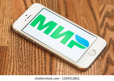 2018.04.23 Kazan Russia - Russian MIR Payment System Logo On Apple Iphone 5 SE Screen.