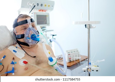 2018-05-31, Belarus, Grodno Regional Cardiac Centre. White Male Patient Performs CPAP Therapy Using CPAP Mask In Intensive Care Department. Editorial Use Only.