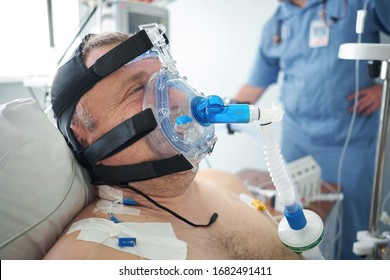 2018-05-31, Belarus, Grodno Regional Cardiac Centre. White Male Patient Performs CPAP Therapy Using CPAP Mask In Intensive Care Department. Editorial Use Only.