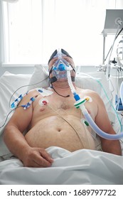 2018-05-31, Belarus, Grodno Regional Cardiac Centre. White Male Patient Performs CPAP Therapy Using CPAP Mask In Intensive Care Department. Editorial Use Only. 