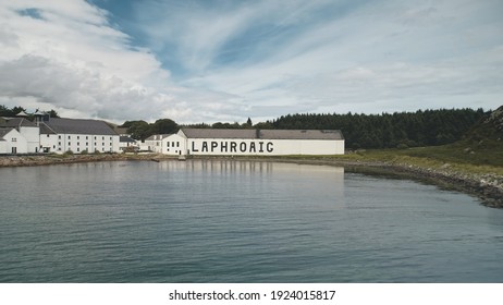 2018.08.07 - Laphroaig Distillery, Port Ellen, Islay Island, United Kingdom. Europe Whiskey Industry. Closeup Aerial Alcohol Industry, Great Britain. Old Building At Ocean Bay. Nobody Nature Seascape