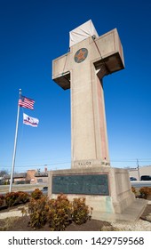 2019 BLADENSBURG MARYLAND USA FEB 25 Peace Cross: Low Angle View Of American Flag, 100th Anniversary Flag At The World War I Memorial Commissioned By The American Legion Built 1919-1925 On Alt Rt 1.