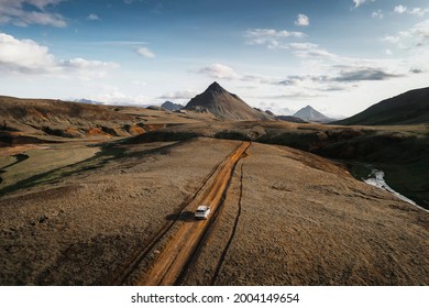 2019, Iceland, White Landrover driving on a dusty sand road - Powered by Shutterstock