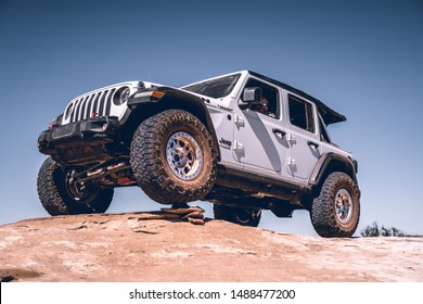 2019 Jeep Wrangler JL Rubicon with 37" tires on beadlock whhels offroading at Moab, UT.