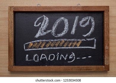2019 loading with progress bar, chalk drawing on blackboard