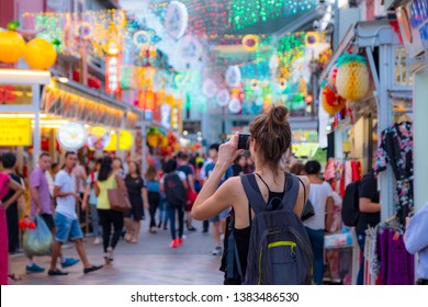 2019 March 1st, Singapore, Chinatown - People Walking And Shopping On The Street Market After Sunset.