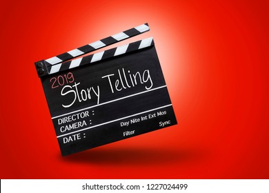 2019 story telling ,text title on movie Clapper board on red colour backgrounds - Shutterstock ID 1227024499