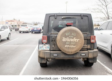 2019_01_12_Tulsa OK USA Dark Dirty Off Road Jeep Parked In Parking Lot With Wheel Cover Reading All Who Wander Are Not Lost - Life Is Good