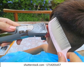 2020 At Ayutthaya., A Picture Of A Man Was Cutting His Hair At Home Because The Barber Shop Was Closed For Service Due To The Effects Of The Covid -19 Virus Epidemic.