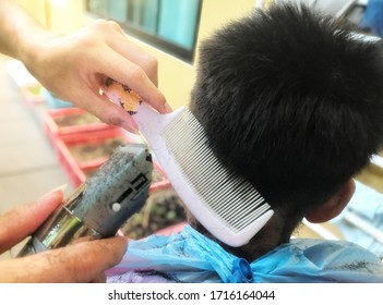 2020 At Ayutthaya., A Picture Of A Man Was Cutting His Hair At Home Because The Barber Shop Was Closed For Service Due To The Effects Of The Covid -19 Virus Epidemic.
