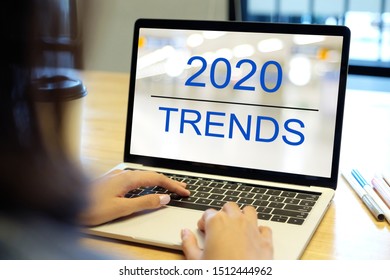 2020 Digital Trends, Woman Hand Tying Laptop Computer With 2020 Trends On Screen Background, Digital Marketing, Business And Technology Concept