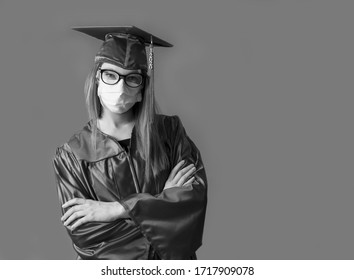 2020 Graduation Student In Cap And Gown With Cap And Gown Arms Folded