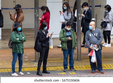 2020 Mar 17,Hong Kong.People Waiting The Bus On The Streets At Kwun Tong,They Wearing Face Masks To Prevent Coronavirus(Covid-19).