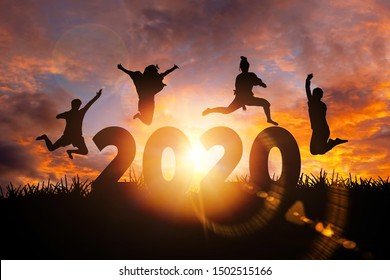 2020 New Year silhouette of woman jumping during golden sunrise or sunset with copy space. Image for Happy new year 2020 concept.