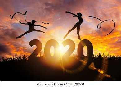 2020 New Year : Young Gymnast Woman Dance Ribbon Silhouette Performing Rhythmic Gymnastics On 2020 New Year, Jumping Doing Split Leap In The Air, Happy New Year Concept
