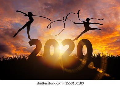 2020 New Year : Young Gymnast Woman Dance Ribbon Silhouette Performing Rhythmic Gymnastics On 2020 New Year, Jumping Doing Split Leap In The Air, Happy New Year Concept
