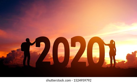 2020 Newyear  Couple Tries To Push Number Of 2020 Happy New Year Concept