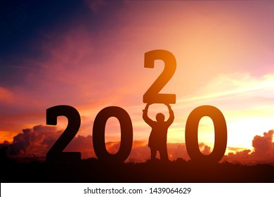 2020 Newyear Man Tries To Lift Up Number Of 2020 Happy New Year Concept