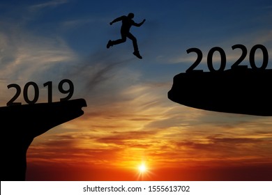 2020 Newyear Silhouette Men Jump Over Rocks To Jump In 2020 - Image