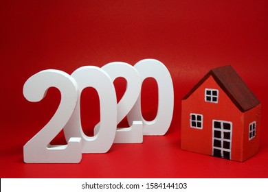 2020 Number Wooden Figures With House Figures Object On Red Background - Happy New Year 2020 , Chinese New Year - Red Concept - Home Building Trends