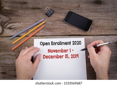 The 2020 Open Enrollment Period from November 1 to, December 15, 2019. Hands on working desk doing business