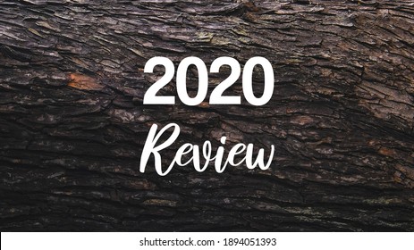 2020 Review Incription On Mahogany Wood Background