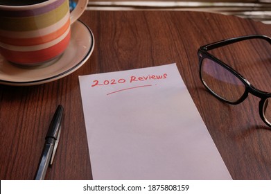 2020 review ; last year review in life ; business. Writing and preparing for new year 2021 resolutions - Shutterstock ID 1875808159