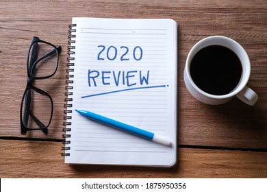 2020 Review; Last Year Review In Life; Flat Lay Business Concept. Writing And Preparing For New Year 2021 Resolutions