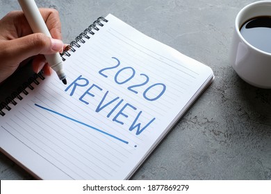 2020 Review; Last Year Review In Life; Flat Lay Business Concept. Writing And Preparing For New Year 2021 Resolutions