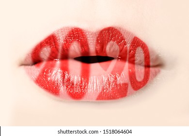 2020 written with red lipstick on womanl lips, new year card