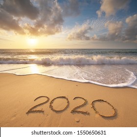 2020 year on the sea shore during sunset. Element of design. - Powered by Shutterstock