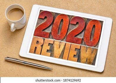 2020 year review banner - annual review or summary of the recent year - word abstract in letterpress wood type blocks on a digital tablet with a cup of coffee