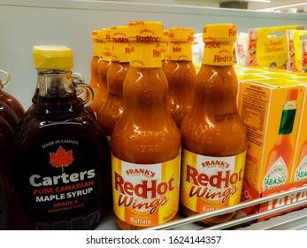 2020/01/23, Prague, Czech Republic: Bottles Of Frank's Red Hot Wings Sauce, Buffalo Flavor, Next To Bottles Of Carter Maple Syrup And Tabasco In A Grocery Store